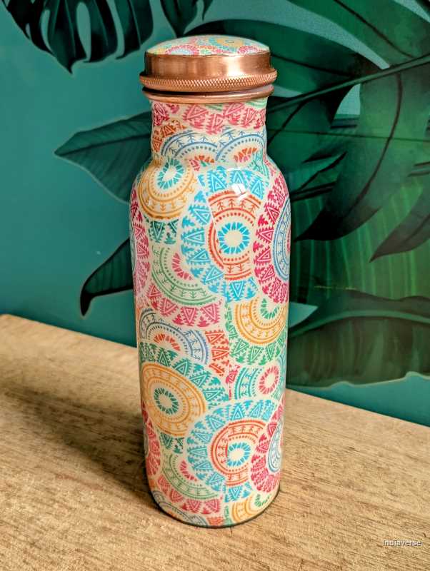 pastel colored enameled copper bottle with lid and with colorful ethnic design for drinking water up to 600 ml capacity