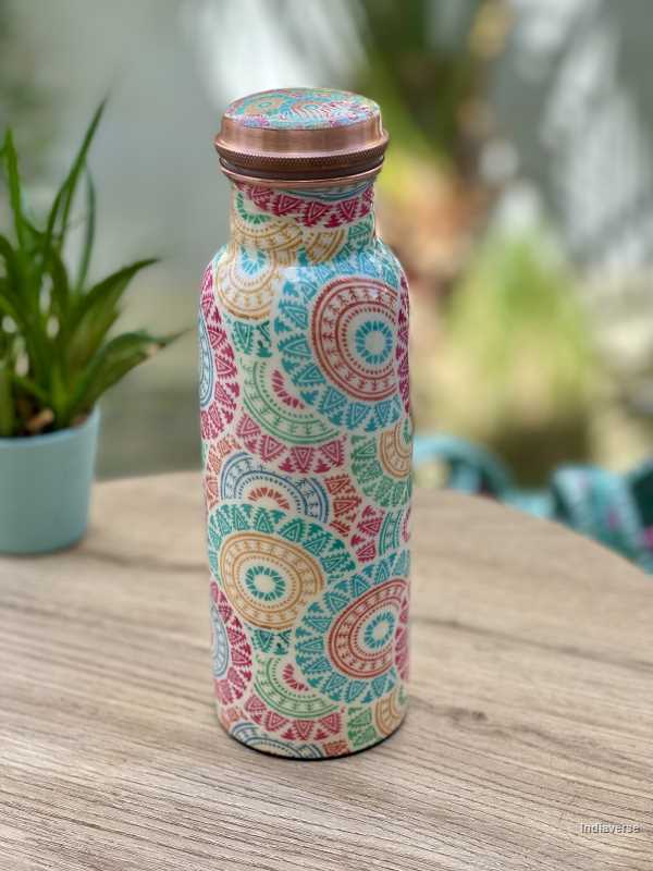 pastel colored enameled copper bottle with lid and with colorful ethnic design for drinking water up to 600 ml capacity
