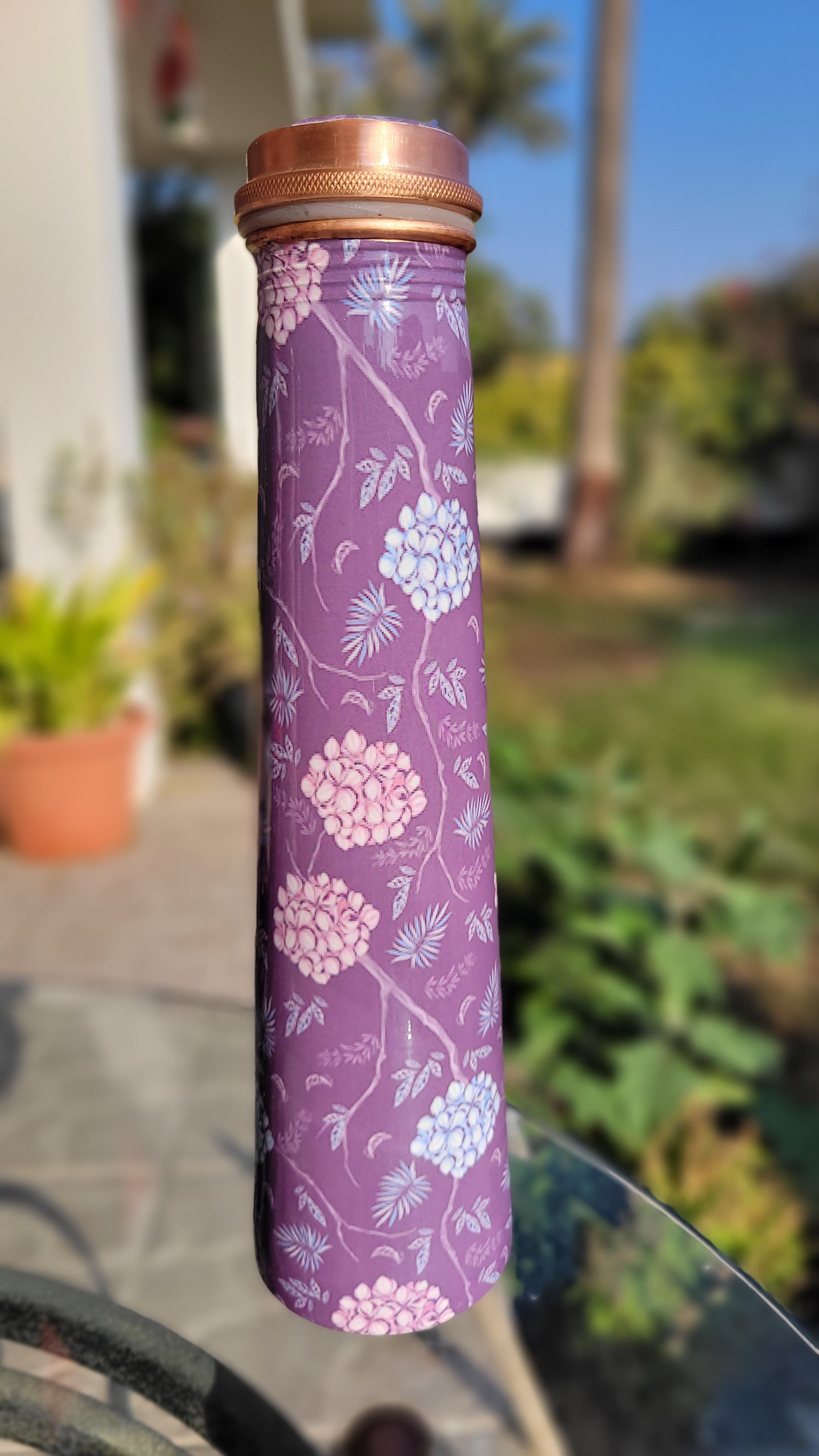 Enameled copper bottle in elegant tower shape with purple flower design with 700 ml capacity for drinking water