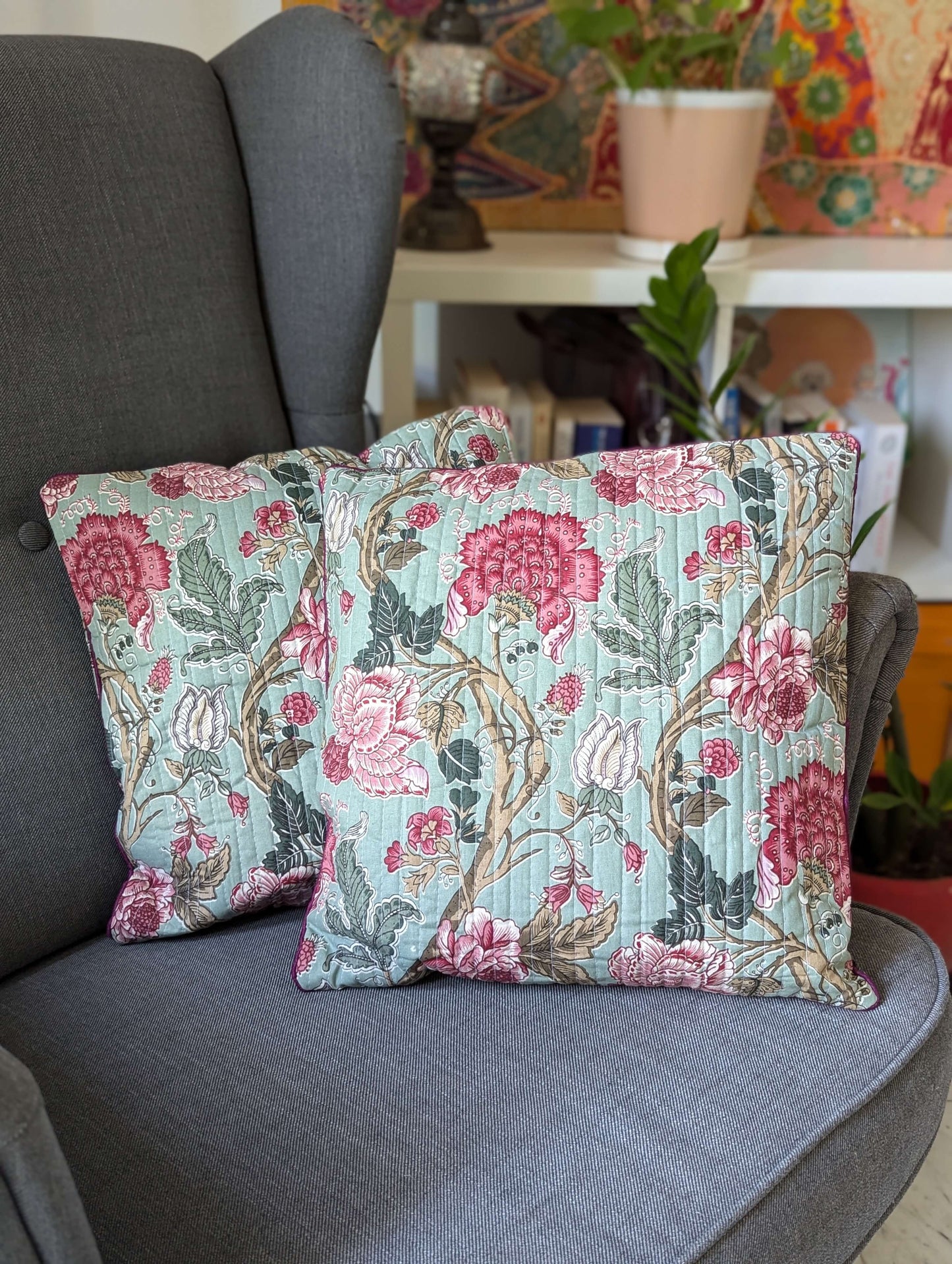 cushion-cover-with-pink-and-red-flower-design-on-a-turquoise-color-base