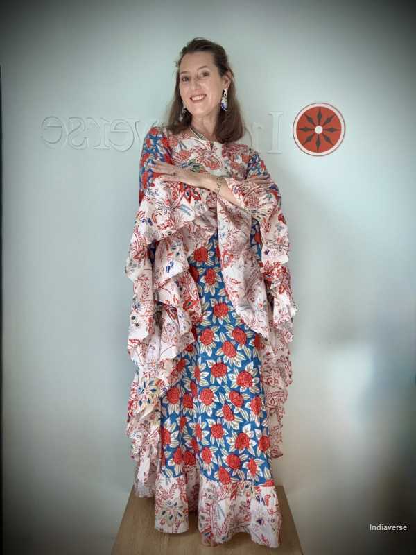 Woman wearing a floral dress with a plain background