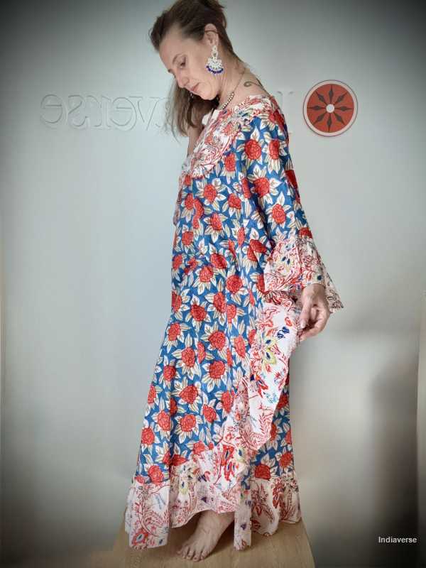 Woman wearing a floral dress with a plain background