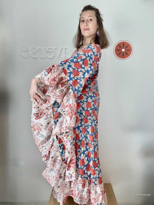 Woman wearing a floral dress with a plain background