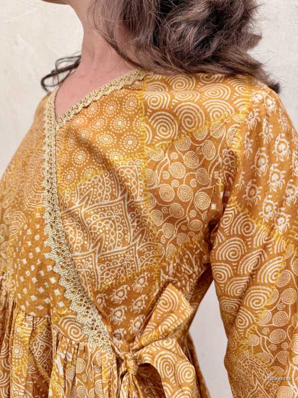 Yellow patterned dress with a plain background