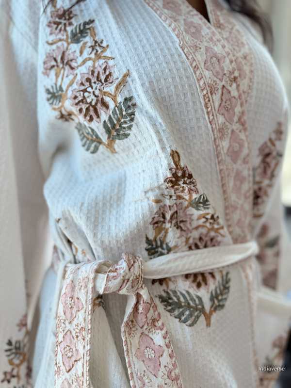Floral embroidered robe with a tie detail on a neutral background