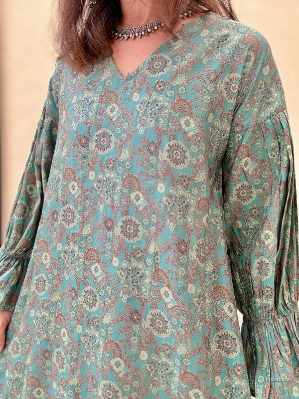 Long-sleeve dress with floral pattern on a beige background