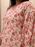 close up of a dress with red flower print