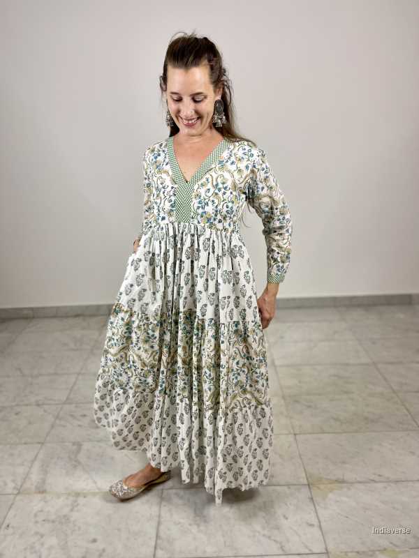 hand block printed soft cotton maxi dress in green and blue tones with complimenting floral designs and matching border and has a cotton underskirt