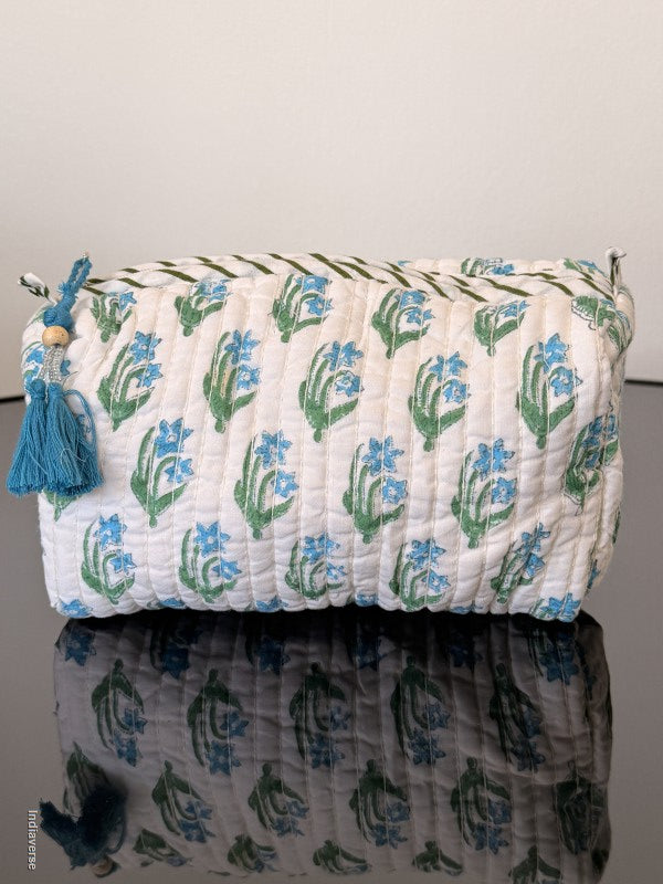 Two bags with floral patterns on a plain background