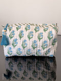 Two bags with floral patterns on a plain background
