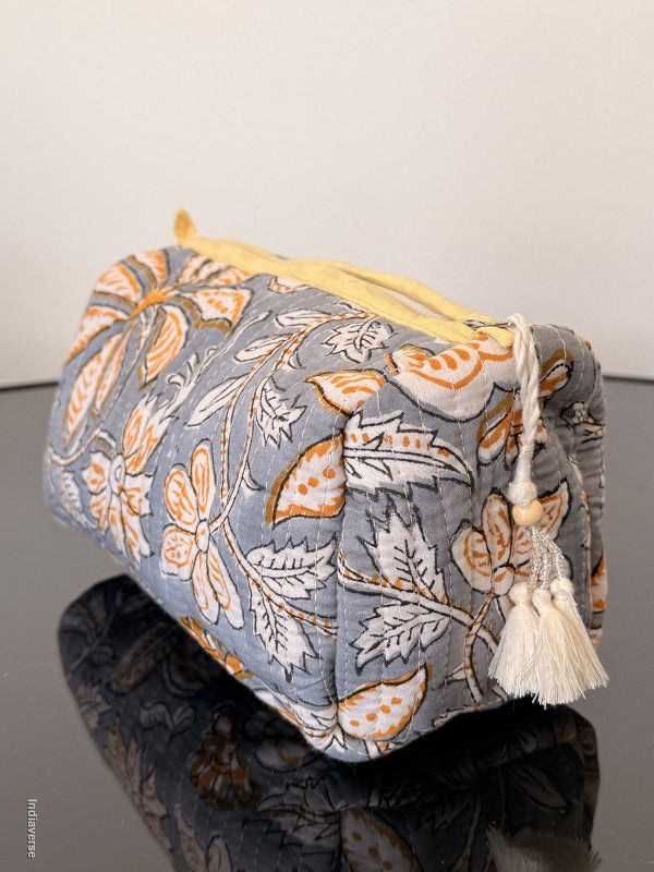 Floral patterned drawstring bag on a plain background