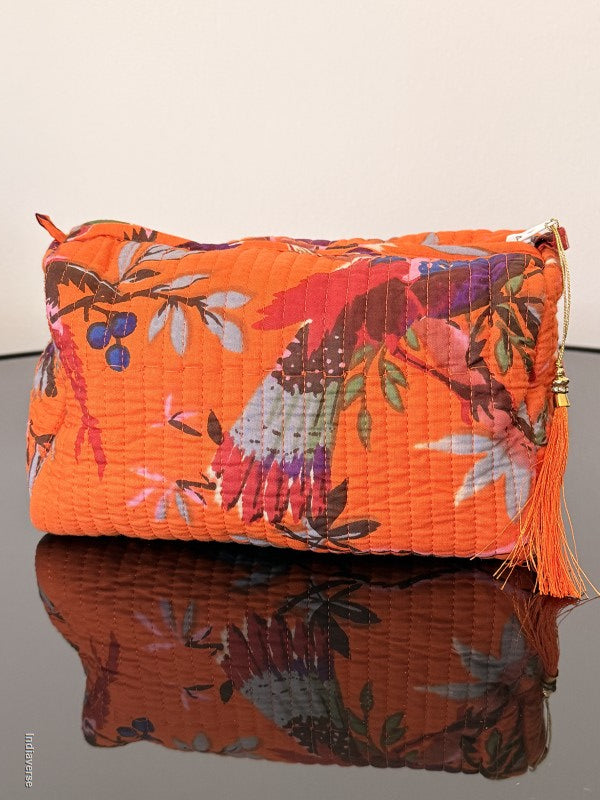 Two folded fabric pieces with floral patterns on a plain background