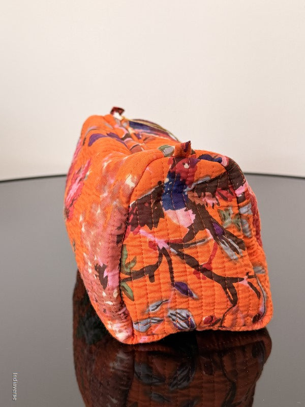 Floral-patterned drawstring bag on a plain background