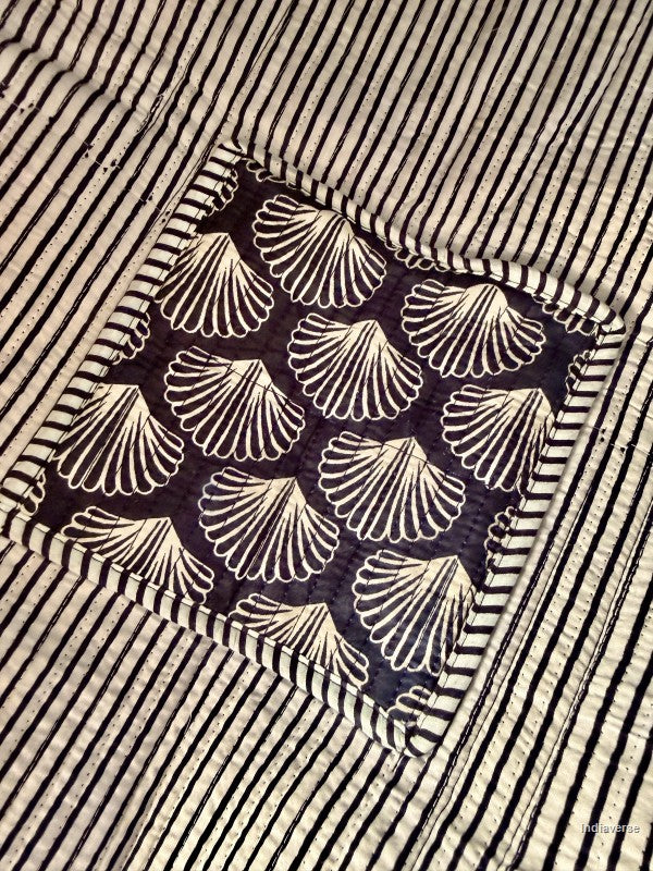 Textile with shell pattern on a striped background