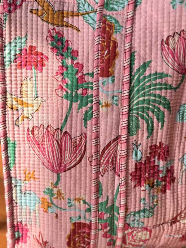 Floral and bird patterned fabric with pink background