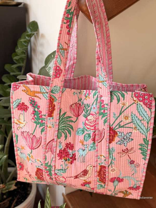 Floral patterned tote bag with a plant in the background