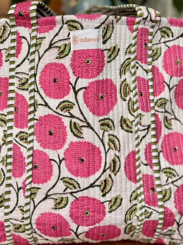 Handbag with pink floral pattern and 'Indiaverse' label