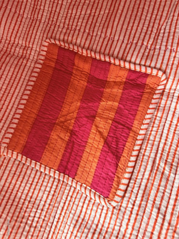 close up of the inside pocket with pink and orange stripes