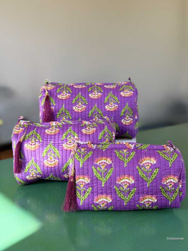 Toiletry Pouch Set with symmetric flower design and purple background in three different sizes for toiletries and cosmetics | Purple Flowers