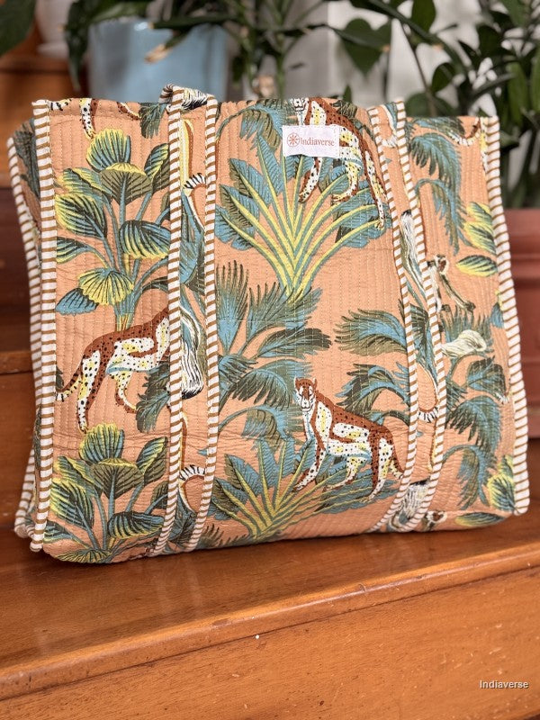 Tropical patterned bag with animals on a wooden surface