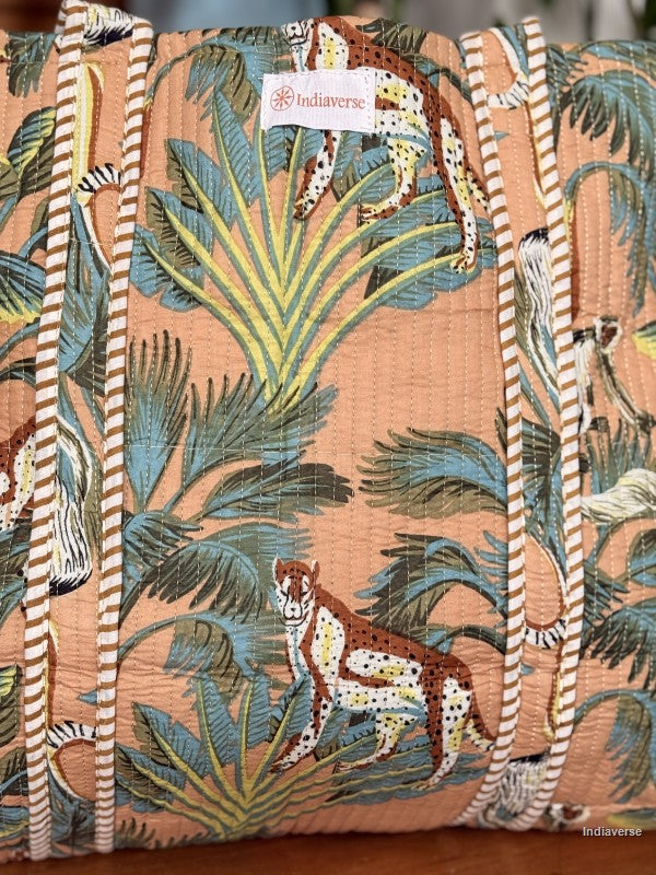 Patterned fabric with jungle animals and leaves, featuring the brand 'Indiverse'.