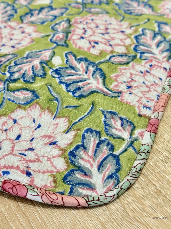 Floral patterned laptop sleeve close up on a wooden surface