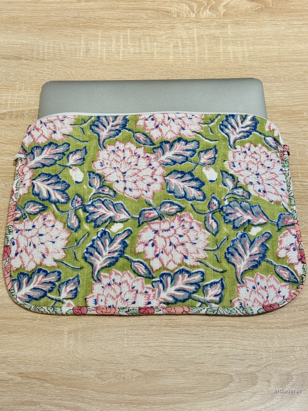 Floral patterned laptop sleeve on a wooden surface