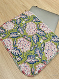 Floral-patterned mouse pad on a wooden surface