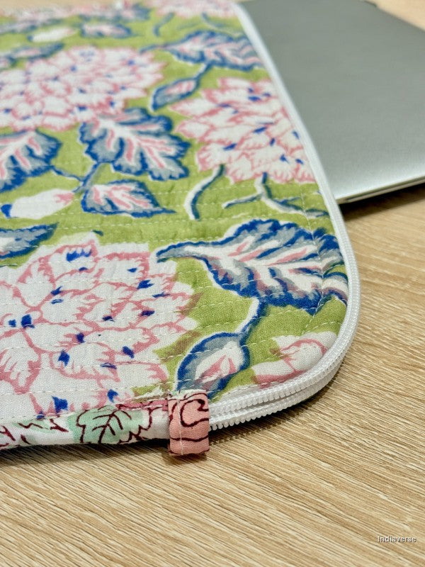 Floral-patterned laptop pouch on a wooden surface