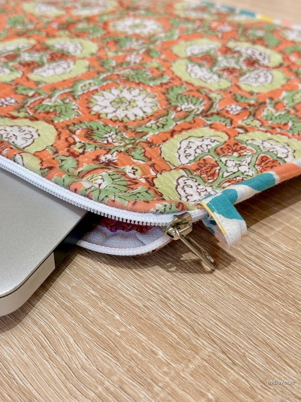 Colorful floral-patterned zippered pouch on a wooden surface
