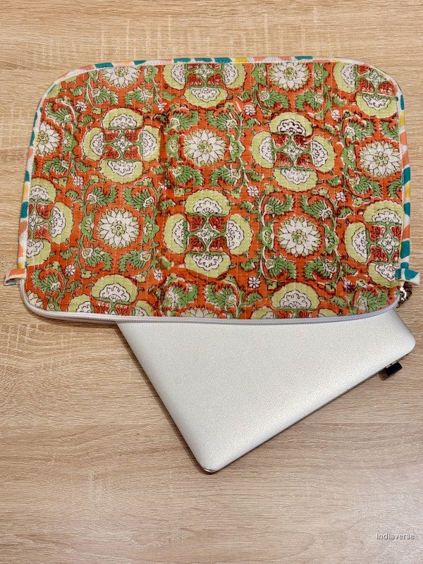Floral patterned laptop sleeve on a wooden surface