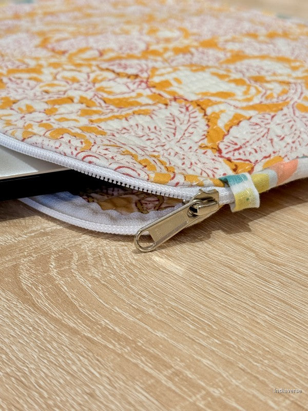 Floral-patterned pouch with a zipper on a wooden surface