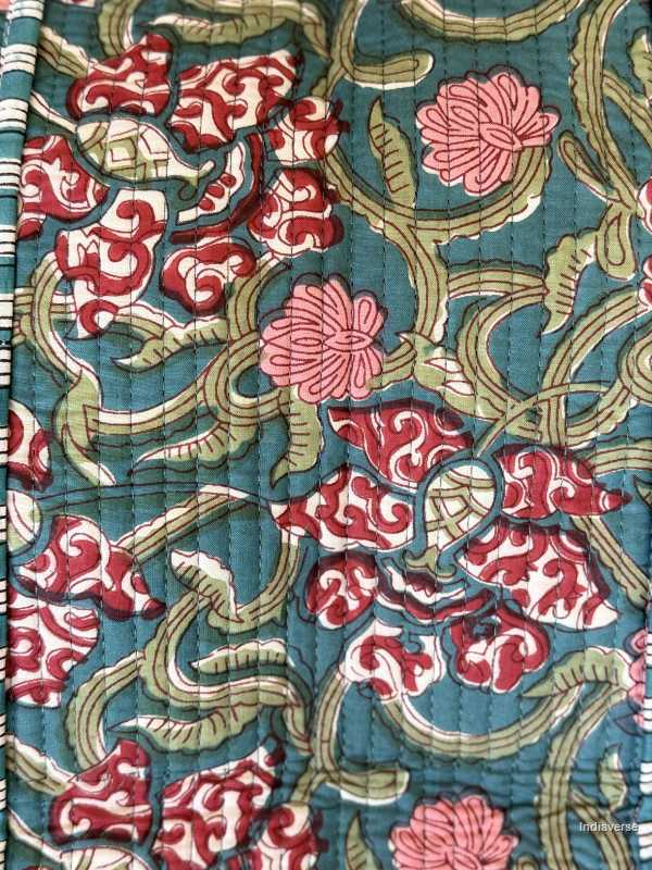 beautiful hand block printed quilted cotton tote bag with water inspired floral design perfect tot carry all your essentials close up of the design