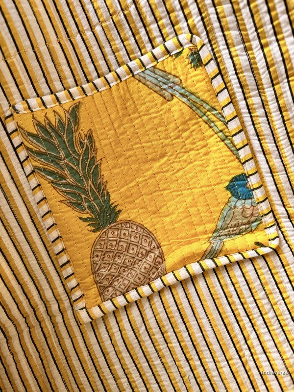 Close-up of inside pocket with pineapple design on a striped background