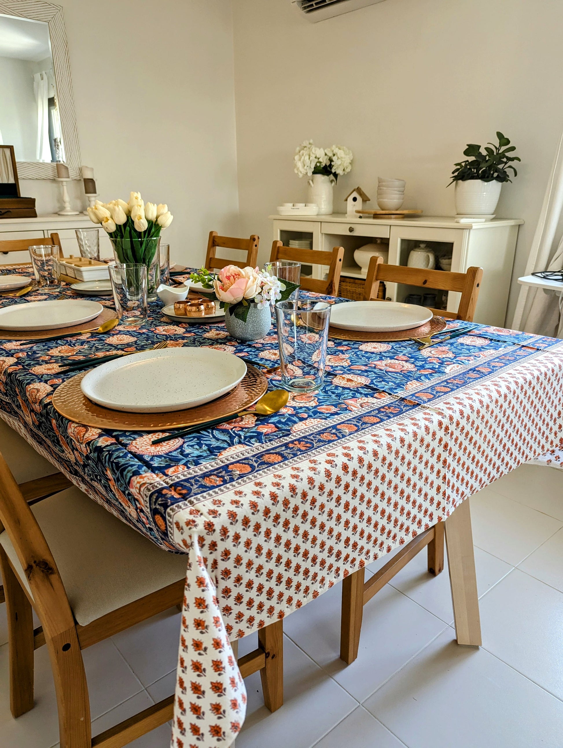 rectangular-tablecloth-for-6-seater-table-with-orange-flowers-on-blue-background-with-small-orange-flower-border