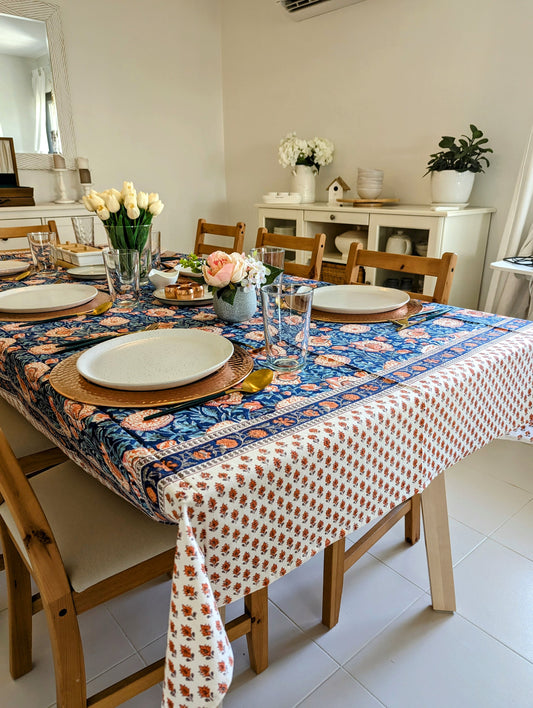 rectangular-tablecloth-for-6-seater-table-with-orange-flowers-on-blue-background-with-small-orange-flower-border