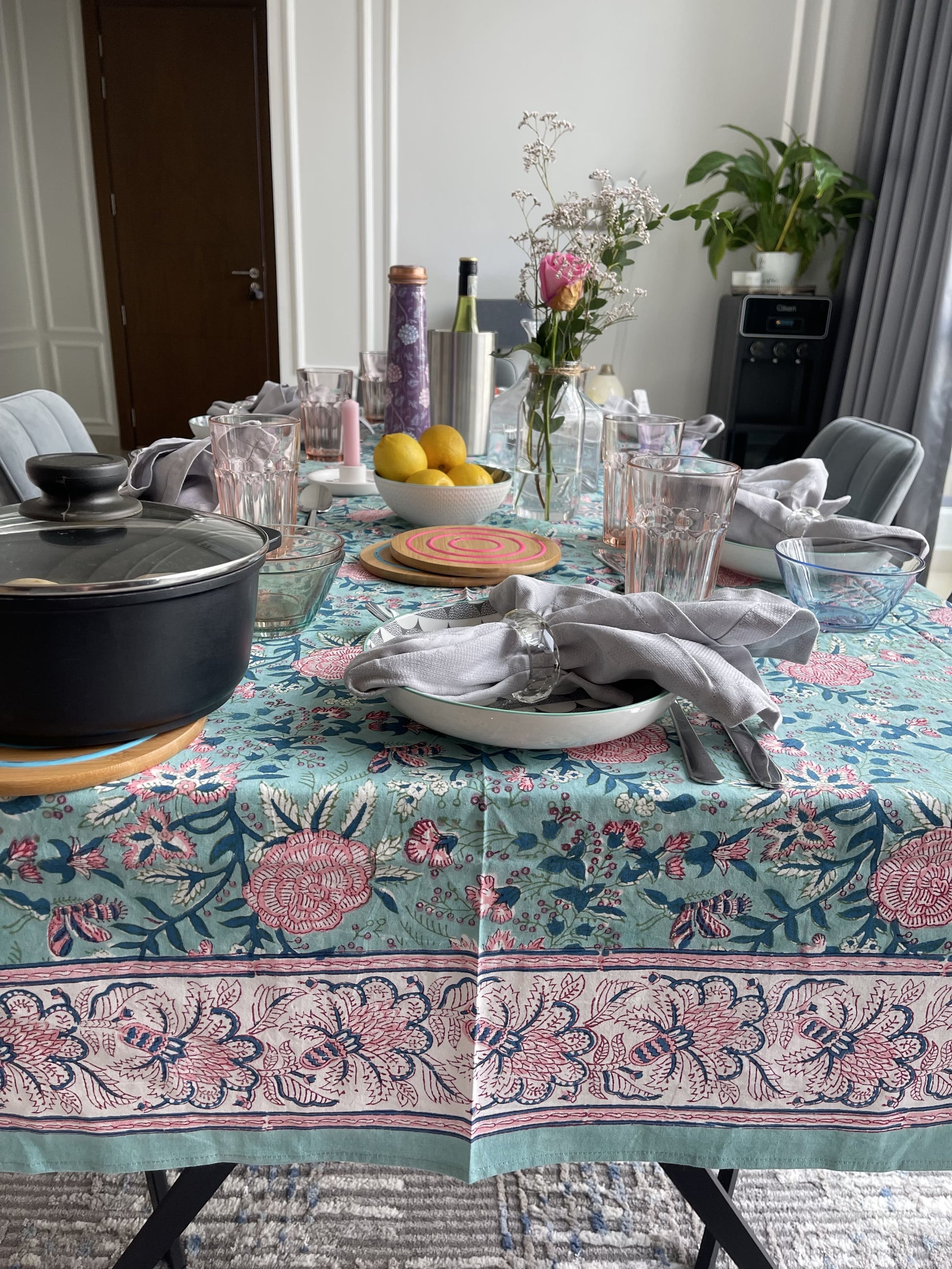 rectangular-tablecloth-for-6-seater-table-with-pink-flower-design-on-turquoise-background-with-white-and-pink-border