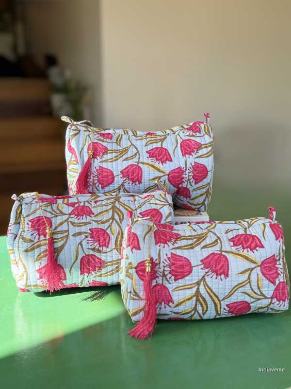 Toiletry Pouch Set with red tulip design and sky blue background in three different sizes for toiletries and cosmetics | Red Tulips