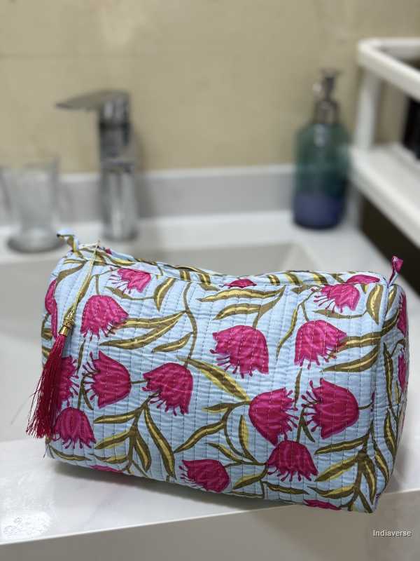 Toiletry Pouch Set with red tulip design and sky blue background in three different sizes for toiletries and cosmetics | Red Tulips