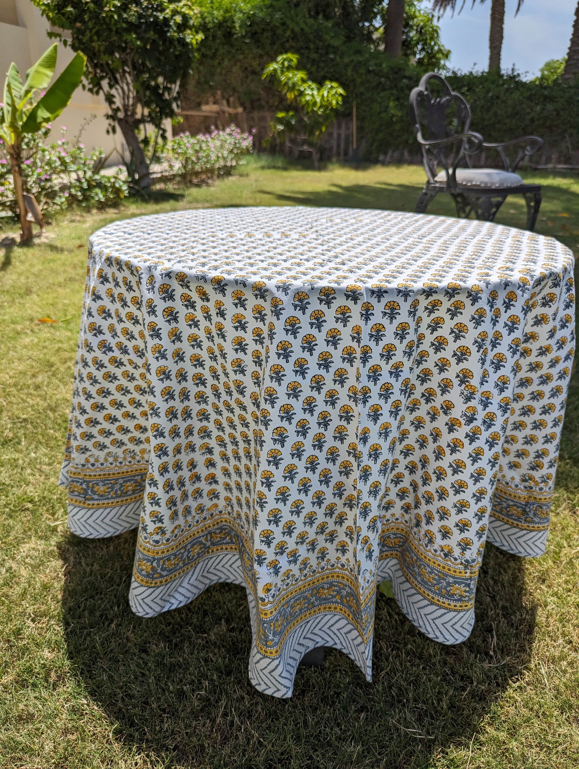 round-table-cloth-with-tiny-yellow-flowers-handblock-printed-on-white-background-with-yellow-border