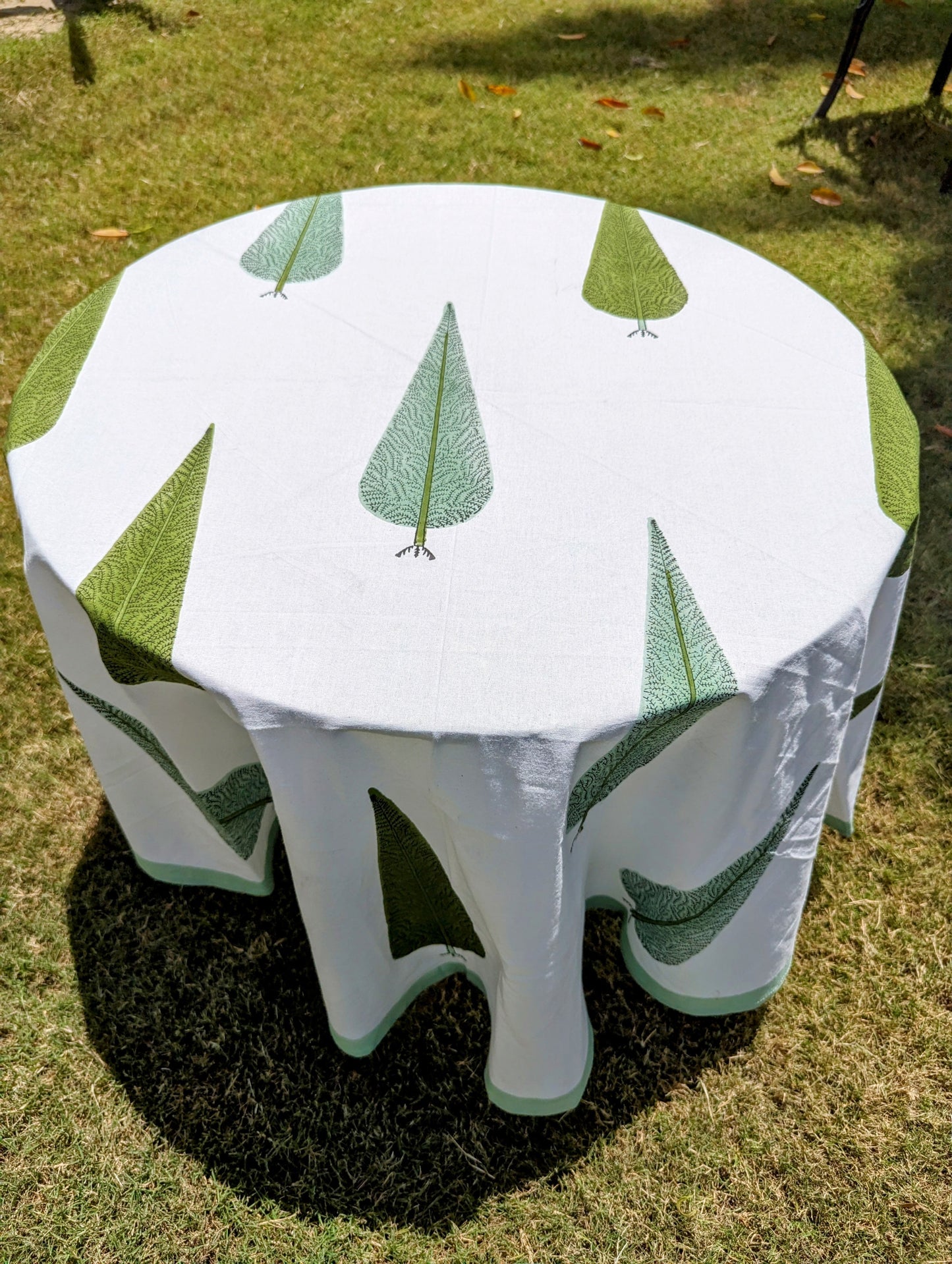 round-tablecloth-with-handblock-printed-cypress-tree-on-white-background-with-green-border