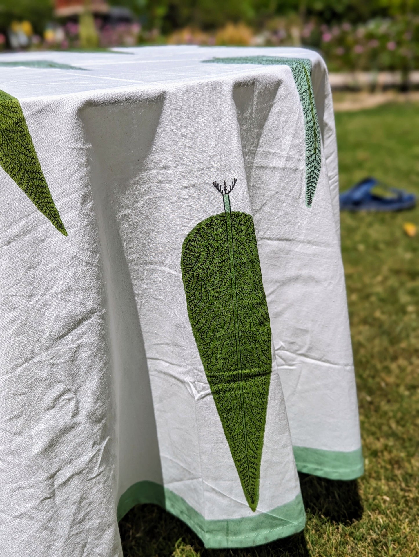 round-tablecloth-with-handblock-printed-cypress-tree-on-white-background-with-green-border