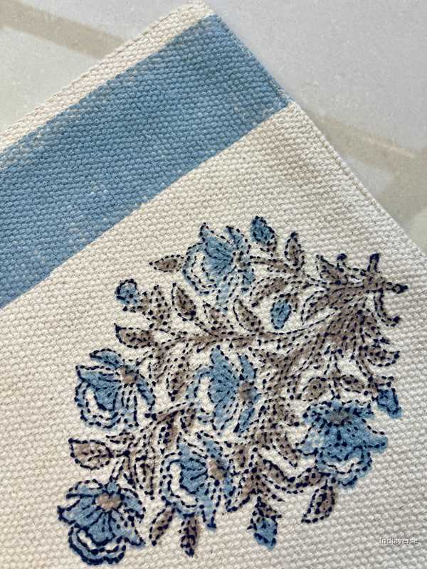 medium size cotton rug hand block printed with blue floral design perfect for the living room or bedroom