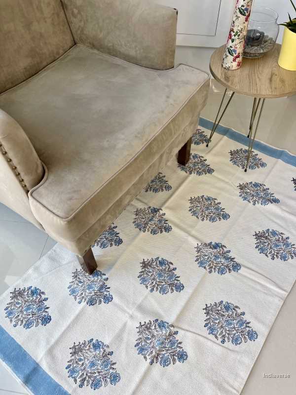 medium size cotton rug hand block printed with blue floral design perfect for the living room or bedroom