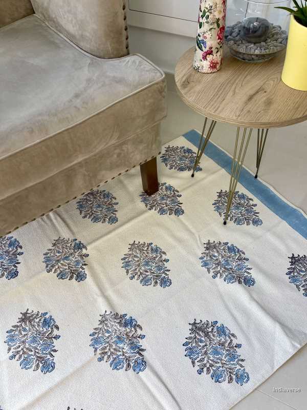 medium size cotton rug hand block printed with blue floral design perfect for the living room or bedroom