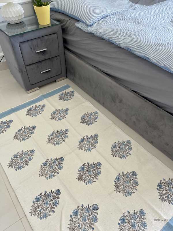 medium size cotton rug hand block printed with blue floral design perfect for the living room or bedroom
