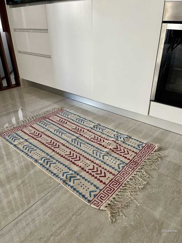 small cotton rug hand block printed with geometrical red and blue pattern perfect for the kitchen, living room or bedroom