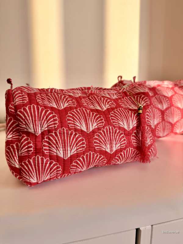 close up of a pouch from the set of three red pouches with sea shell print | Red Sea Shell
