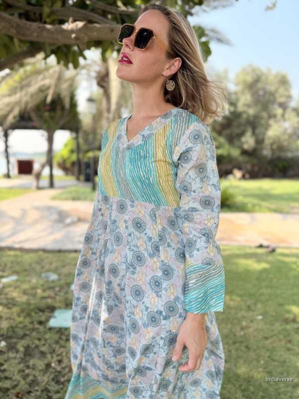 Woman wearing a patterned dress in an outdoor setting