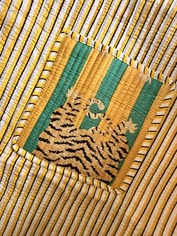 inside pocket of the tiger tote bag showing the tiger on striped fabric